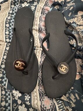 Black Flip Flop Sandals with Gold Logo Accent - Women's
